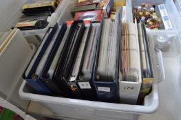 A box of nine collector card albums.