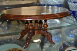 A miniature mahogany oval table.