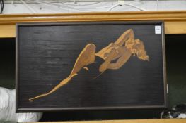 A good marquetry pictorial plaque depicting a reclining female nude.