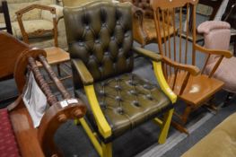 Georgian style open armchair with buttoned green leather upholstery.