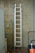 An aluminium three section ladder.