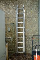 An aluminium three section ladder.