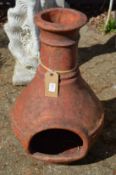 A terracotta chimenea.