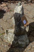 A reconstituted stone garden fountain modelled as a fish.
