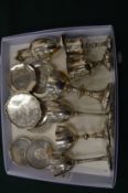 A collection of ecclesiastical small silverware to include chalices and patens.