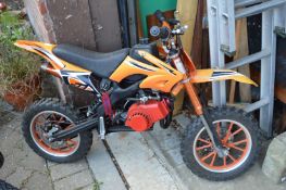 A childs petrol trial motorbike.