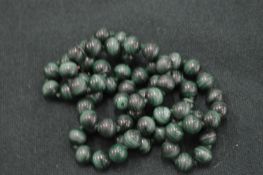 A malachite bead necklace.