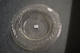 A large cut glass circular dish.