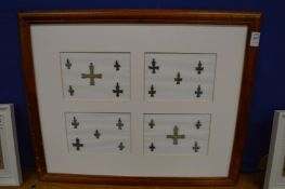 A group of bronze crosses, mounted and framed.