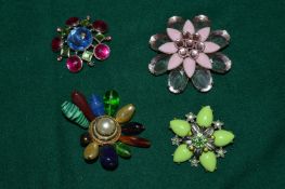 Four vintage brooches.
