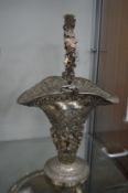 A Continental embossed white metal flower basket.