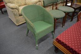 A Lloyd Loom chair.