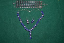 Decorative cloisonne necklace with matching earrings and another bracelet.