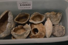 A collection of lead antiquities including five English Civil War gunpowder measures, a Medieval