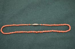 A coral choker.