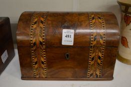 A Victorian inlaid walnut dome topped two division tea caddy.