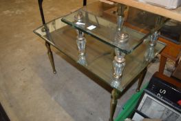 Two-tier glass occasional table.