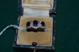A good 18ct white gold diamond and sapphire three stone ring.