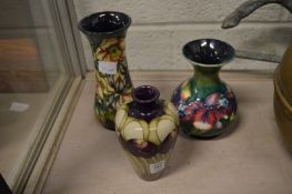 Three modern Moorcroft vases.