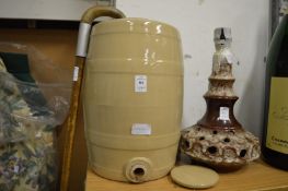 A stoneware flagon, walking stick and a lamp.