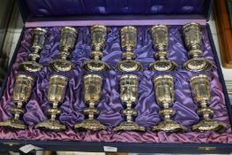 A cased set of twelve Continental white metal ecclesiastical goblets.