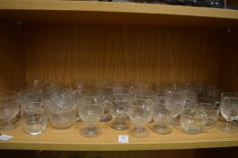 A quantity of glass custard cups.