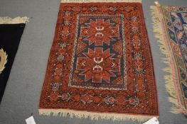 A small Persian style rug, 120cm x 94cm.