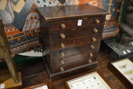 A table top chest containing numerous butterflies.