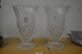A pair of glass vases.