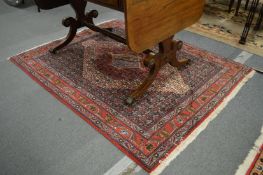 A good small Persian rug with all over floral design, 154cm x 122cm.