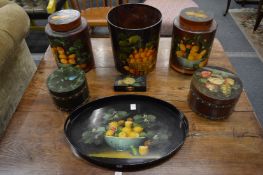 A collection of decoratively painted storage containers, an oval tray and other items.