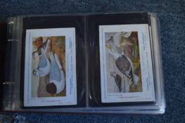Four albums of cigarette cards.