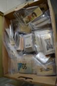 A box of loose cigarette and collectors cards.