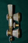 A pair of mother of pearl opera glasses.