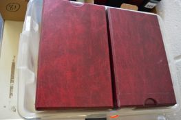 A box of eight cigarette card albums.