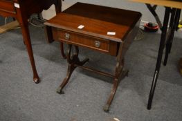 A miniature mahogany sofa table.