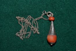Silver and coral pendant and chain.