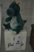 A modern Steiff Cuddly Friends dinosaur with box.