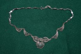 A marcasite pendant and chain.