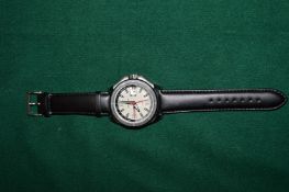 A gentlemans Candino stainless steel wristwatch with leather strap.