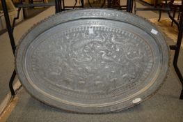 A large Eastern tinned copper oval tray with embossed decoration.