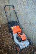 A Flymo petrol rotary lawn mower.