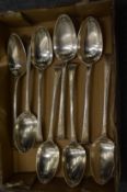 A set of eight silver tablespoons.