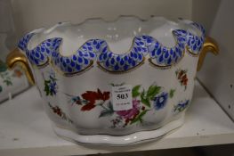A floral decorated porcelain monteith or planter.