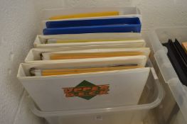 A box of five collector card albums.