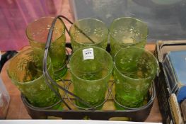 A set of six green retro glass lemonade glasses with glass carrier.