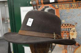 A felt hat and a straw hat.