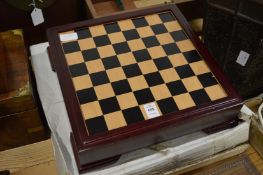 A golfing theme chess set with board and storage box.