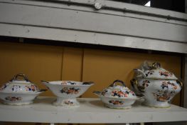 Ironstone tureen with cover and ladle together with a pair of matching covered vegetable dishes
