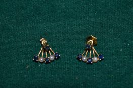 A pair of gold, sapphire and seed pearl earrings.